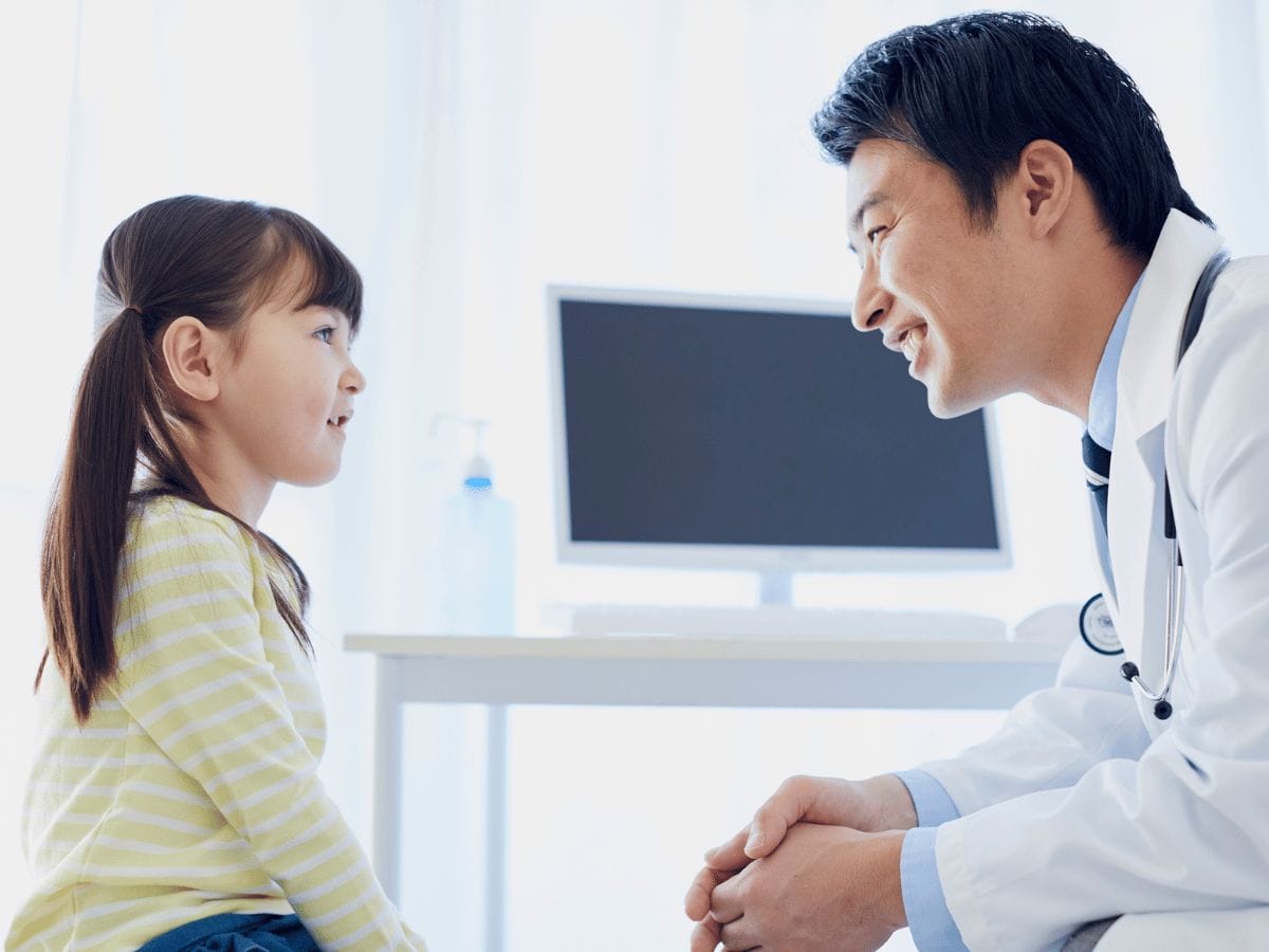 a doctor consulting a child