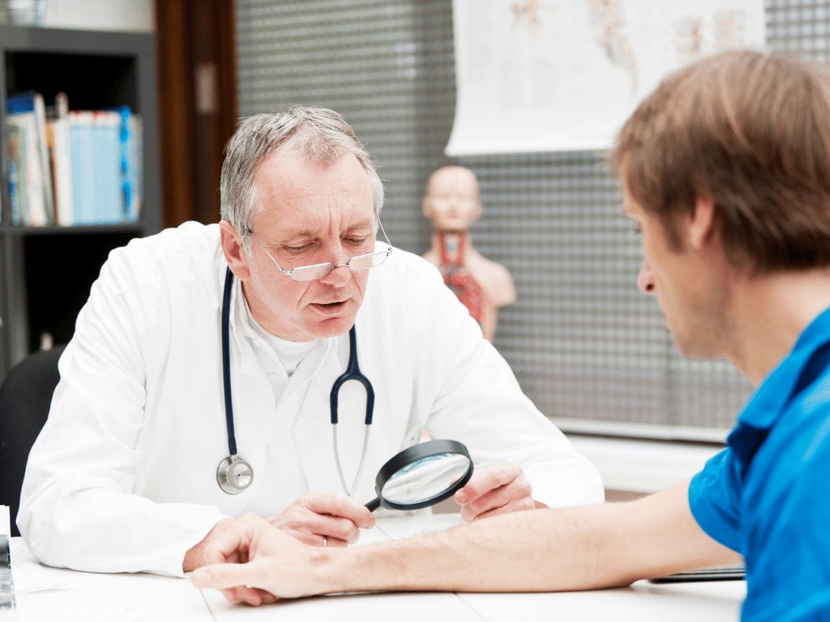 dermatologist consulting a patient