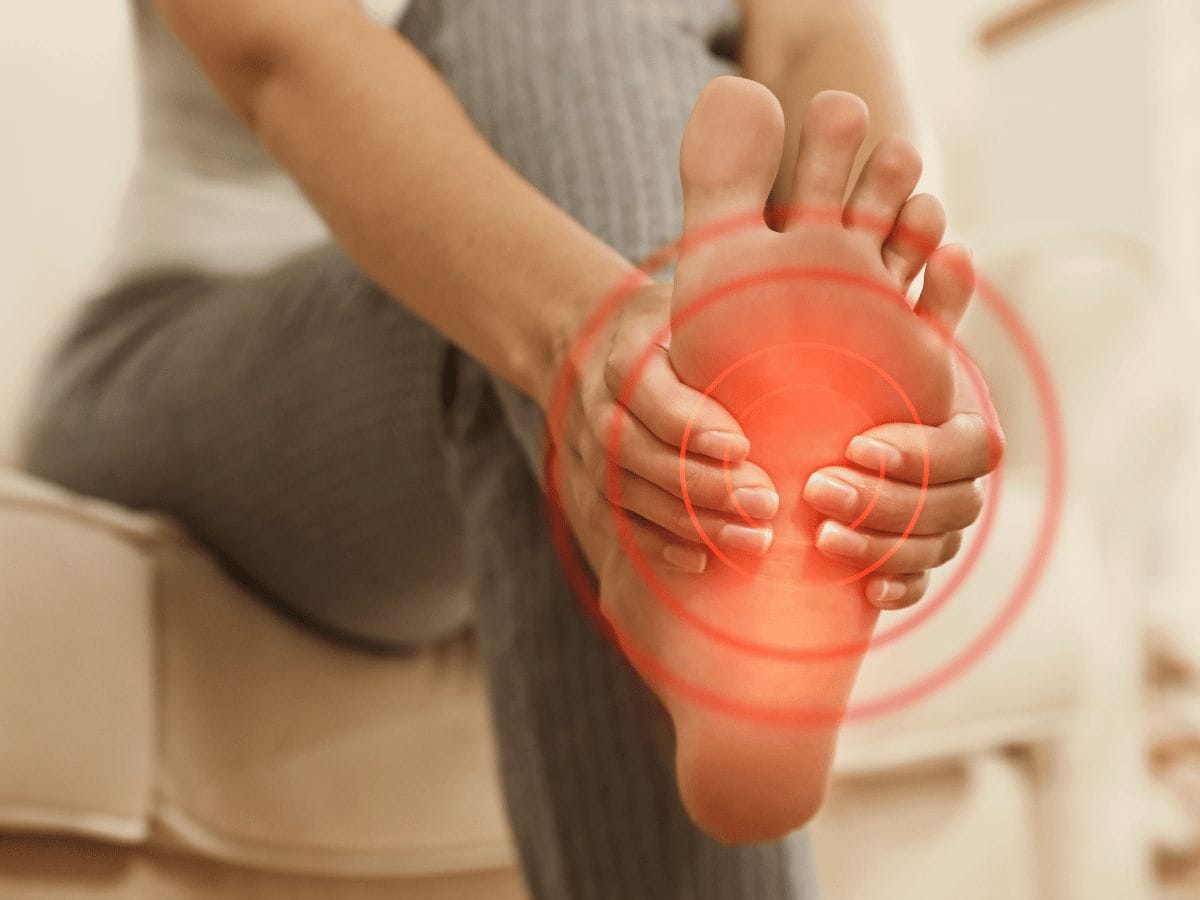 patient with foot pain showing their legs