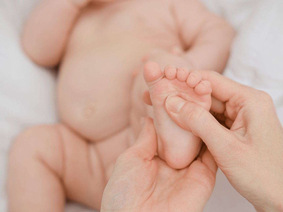 foot of a child getting checked by doctors