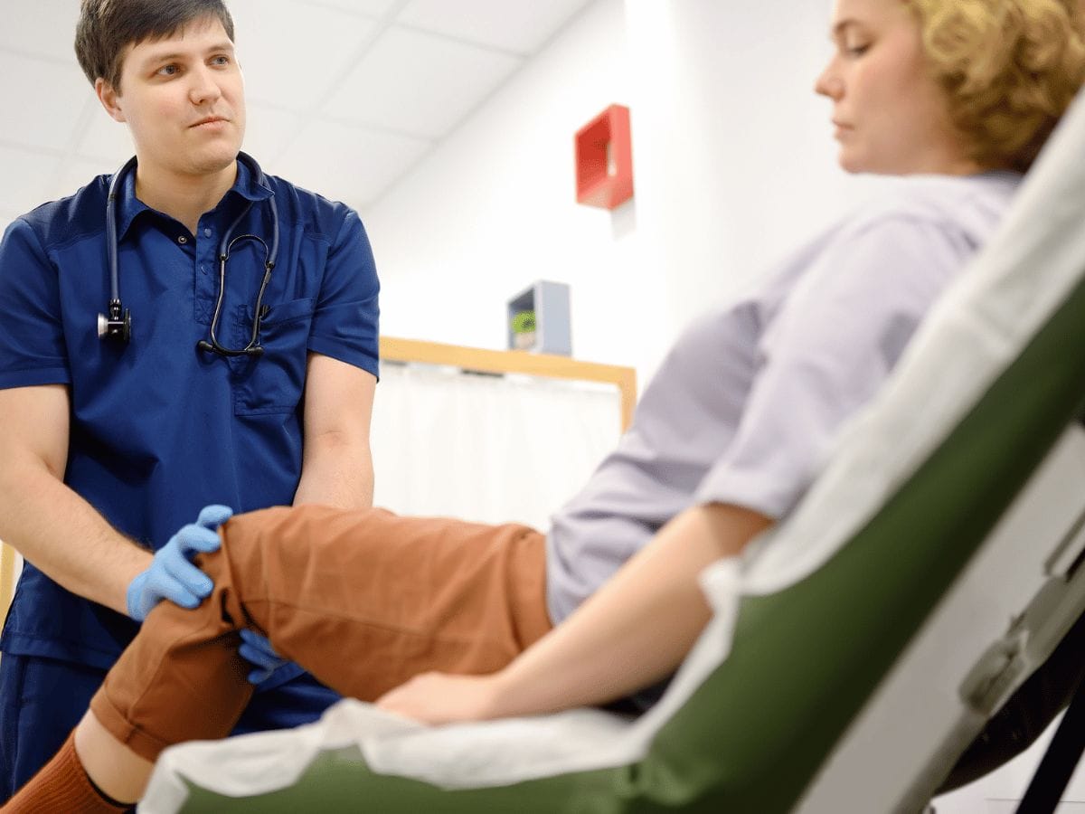 A doctor consulting a patient for her rheumatology issues