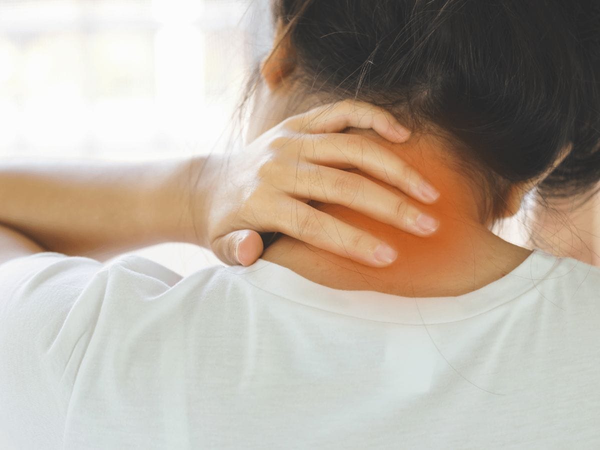 a patient pressing their neck because of neck pain