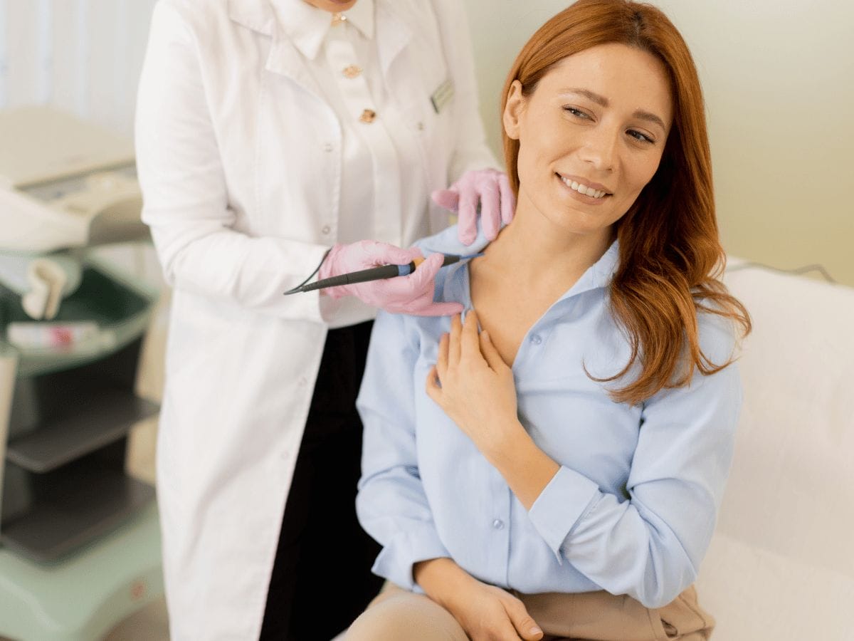 doctor removing plantar warts of a patient using a medical tool