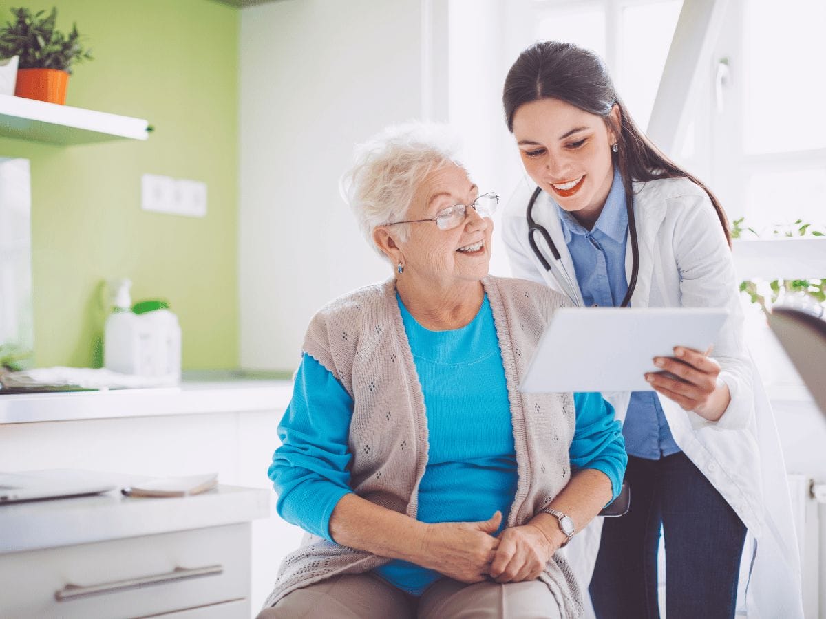 a happy patient interacting with the doctor who salvaged their limb